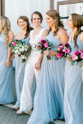 Bride and bridesmaids with their bouquets. Colorful wedding floral!