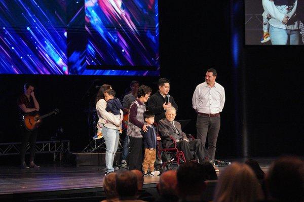 Korea Christian Gospel Mission Founder,  Executive Director, and Family pray over communion.