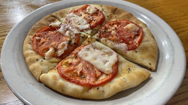 Special Neapolitan Flatbread. Flatbread, local in-season tomatoes, olive oil, herbs, mozzarella and Parmesan.