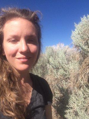 Misha Uhl in a field of sagebrush after which the business is named.