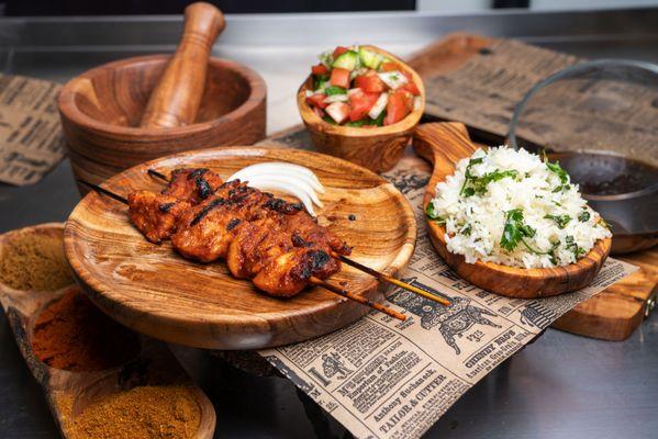 Chicken Suya with cilantro rice and cucumber salad.