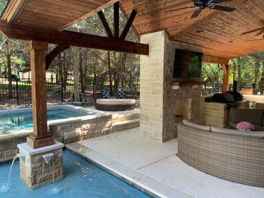 Custom Patio Cover, Fireplace, outdoor kitchen, bar with fans and lighting.