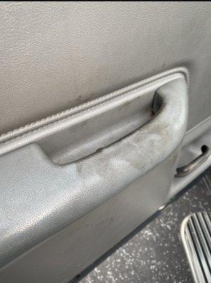 Greasy handprints; All on the steering wheel, door panel and door post