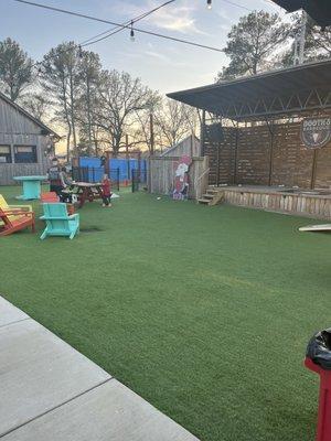 The kids play area and stage area of the yard