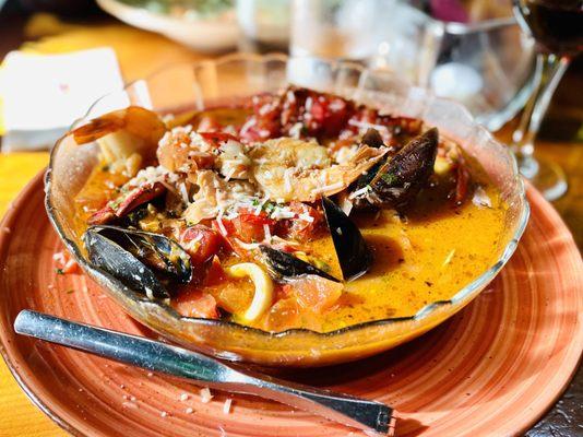 Cioppino - seafood stew of shrimp, scallops, lobster, clams, mussels, calamari, and fish sautéed in a tomato saffron broth