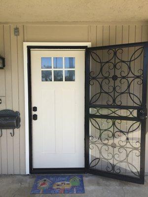 Newly installed primed front door and moulding installed by CA Window and Solar