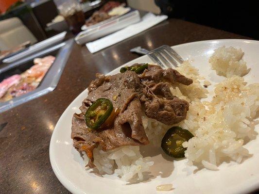 Bulgogi beef with jalapeños on a bed of steamed rice