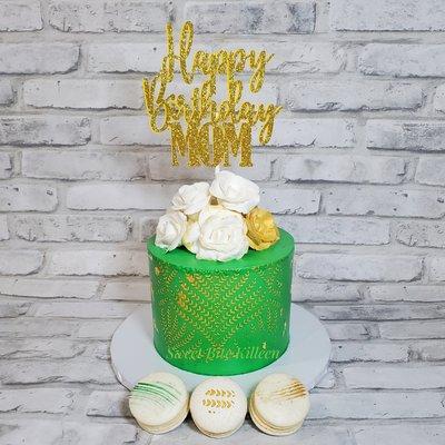 Emerald and gold birthday cake with french macarons