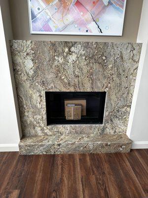 Cosmos- Sienna Bordeaux Granite Fireplace for one of the units at Mirabella Portland.