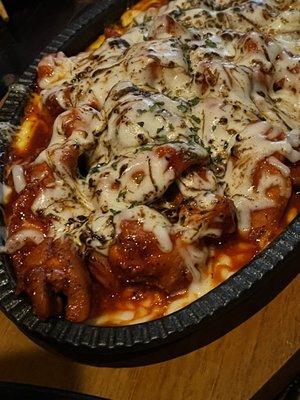 Spicy chicken with melted cheese.