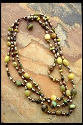 "Olivine" triple strand freshwater pearls, 240.