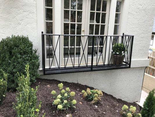 Custom metal balcony and handrails. This design does not meet GA code due to gaps bigger than 4" . Powder coated semi-gloss black