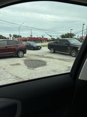 Clowns blocking traffic and people trying to come and go.