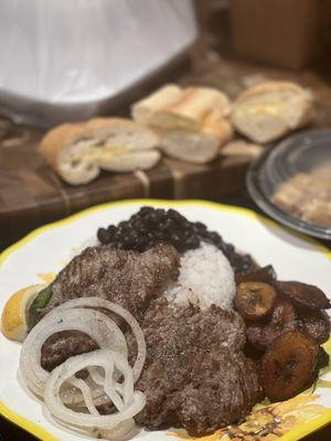 Plated at home: Bistec a la Plancha (grilled steak) and sides.