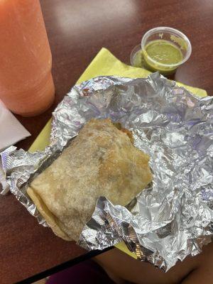 carne asada breakfast burrito with everything, spicy sauce on side, strawberry mango pineapple smoothie