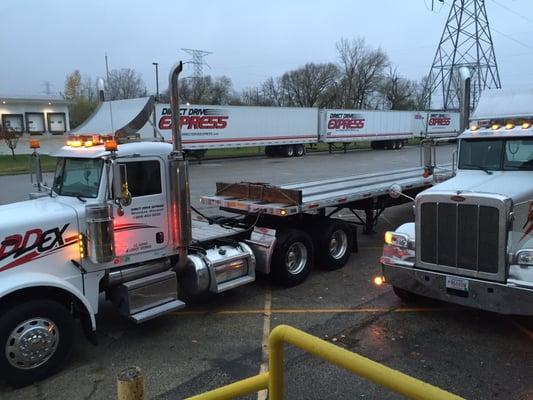 Flatbed Trailer in the DDEX Fleet with 53' Dry Van Trailers in the background