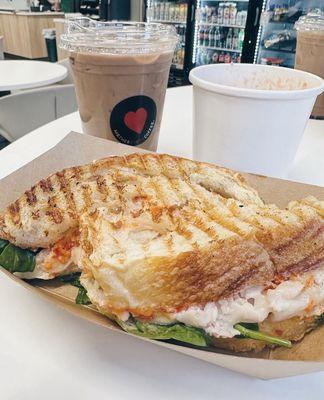 pesto turkey sandwich, tomato soup, and iced latte