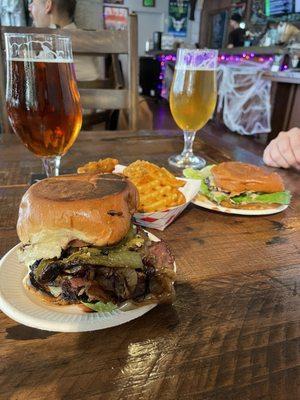 1/4 lbs (towards the back) and 1/2 lbs (in the front) smash burgers with a side of waffle fries and some Stone Beer!