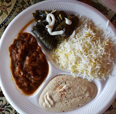 This was our uneventful lunch plate with hummus, rice and overcooked grape leaves served on Styrofoam.