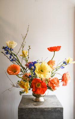 Centerpiece in gold chalice by Rosehip Social Florist.