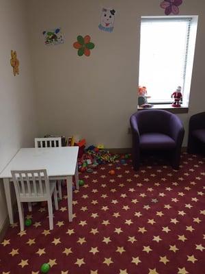 Childrens play area with glass doors so you can keep an eye on the kiddos while you get your work done!