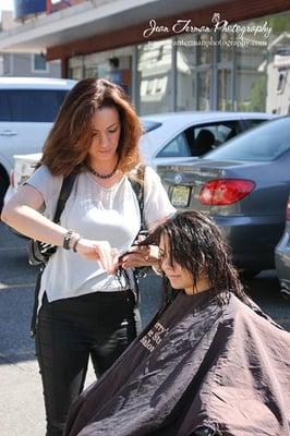 Cutting hair to raise money for 
Lady Bug Charity Event 2012 with Dina Manzo