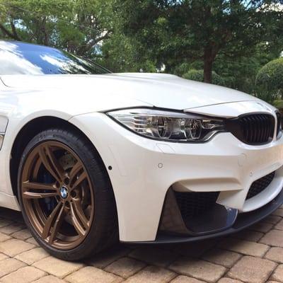 Painted factory wheels bronze and added a carbon fiber chin on 2015 BMW M3