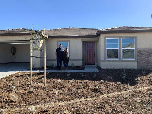 Me and my wife in front of our new build!