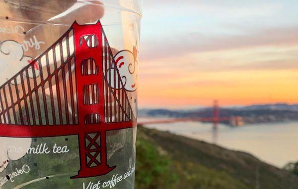 The boba tea glass connecting with the real golden gate