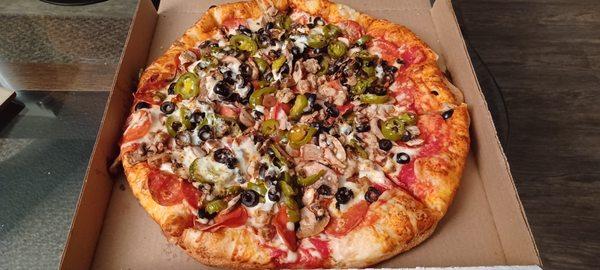 LG, Pepperoni, Sausage, Mushroom, Black Olive, Jalapeños, Extra Sauce and Cheese