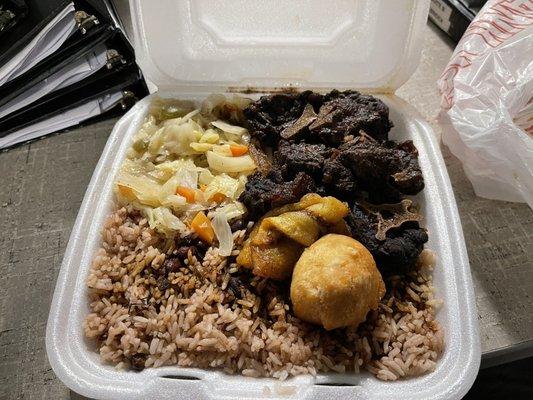 Oxtail Cabbage Fried Plantains  Beans and rice and a roll