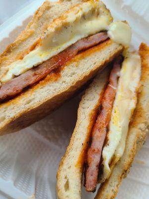 Taylor ham (pork roll??), egg, and cheese on a kaiser roll with ketchup and hot sauce. Yum!