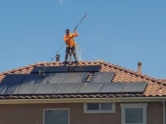 Another solar panel is being cleaned to perfection.