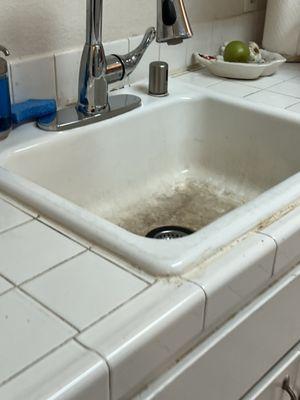 Old kitchen sink and countertop