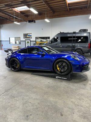 Porsche 911 992 GT3 getting our Xpel paint protection film service.