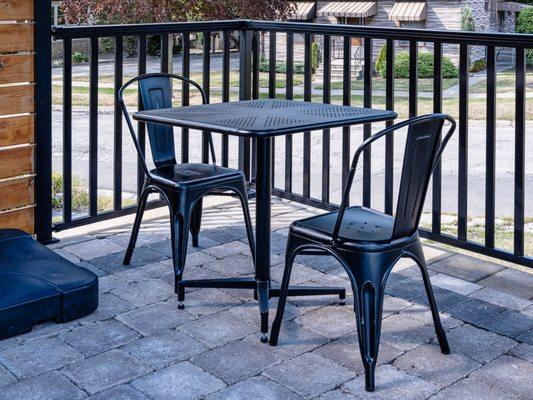 Patio Tolix-style chairs in distressed black (#337-DIB) with outdoor metal folding tables (#ODMF).