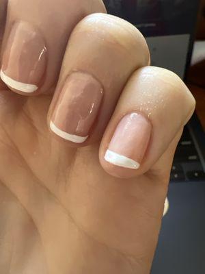 Very uneven french manicure.