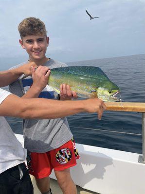 The prize fish.  Technically hooked by the captain but my first time fishing son had a blast reeling it in.