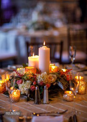 Adding candlelight to enhance the tablescape.