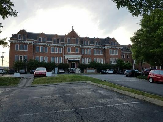 Free parking.  You can park in any unnumbered space.  The main entrance shown will allow you to take the steps upstairs.