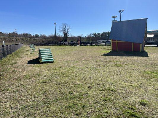 Spacious area for your dog to run, wander and sniff, complete with dog obstacle course