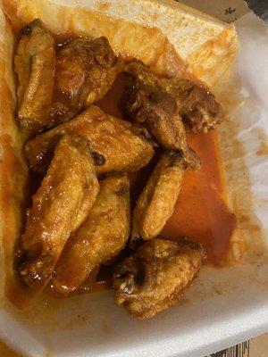 Wings, not crispy, swimming in sauce