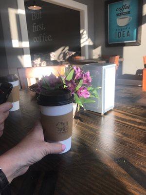 Sunlight streaming in,  comfy tables and chairs.