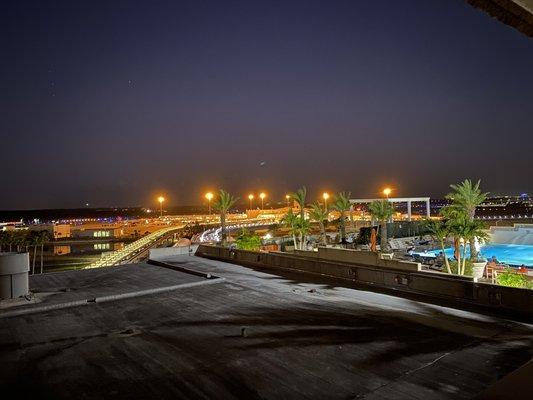 View from the balcony overlooking the runway and the pool