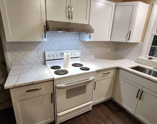 Custom cabinets created and installed by Peeler's Remodeling LLC, Backsplash installation, Quartz countertop installation and custom sink