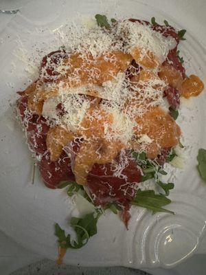 Sirloin of beef carpaccio, shaved Parmesan, arugula, Buongiornos sauce.