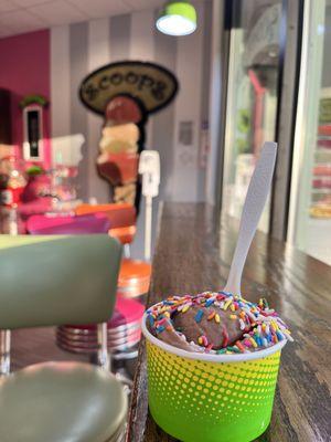 Chocolate ice cream with rainbow sprinkles