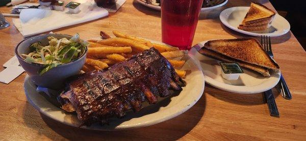 Half rack o' ribs, fries, & cole slaw, with a slice o' toast on the side.