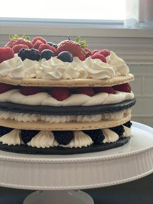 Macaron cake with berries and cream