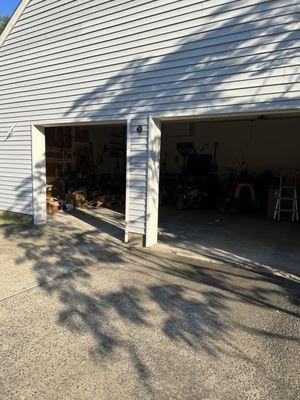 BEFORE: 2 garage doors with no sconces